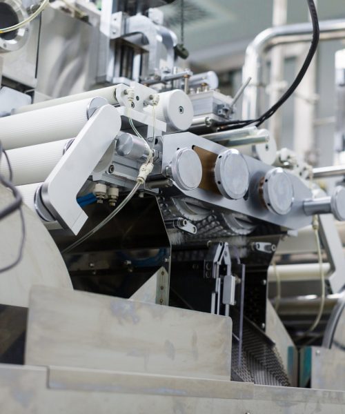 big steel chromed manufacture machine with shafts and computer control panel, from bellow